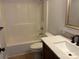 Bathroom featuring a shower-tub combo, a dark vanity and tile floors at 72 Helens Way, Taylorsville, NC 28681