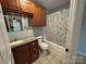 Full bathroom featuring a vanity, a shower-tub combo and decorative shower curtain at 72 Helens Way, Taylorsville, NC 28681