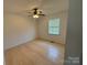 Bedroom featuring hardwood floors, a window and a modern ceiling fan at 72 Helens Way, Taylorsville, NC 28681