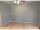 This is a minimalist bedroom with light hardwood floors and light blue walls at 72 Helens Way, Taylorsville, NC 28681