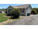 View of the side of the house with neat landscaping and a well-maintained driveway at 72 Helens Way, Taylorsville, NC 28681