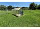 Backyard featuring a functional greenhouse for gardening enthusiasts at 72 Helens Way, Taylorsville, NC 28681