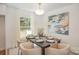 Elegant dining room with a modern chandelier, stylish table setting, and lots of natural light at 8025 Cliffside Dr, Charlotte, NC 28270
