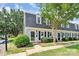 Charming townhouse featuring a well-maintained lawn and classic architectural details at 8062 Knights Bridge Rd, Charlotte, NC 28210