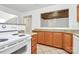 Kitchen features cabinets, granite countertops, tile floors, and an oven and stove at 8062 Knights Bridge Rd, Charlotte, NC 28210