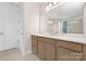 Bathroom with a large mirror, white countertop, wood vanity, and tiled floors at 1074 Wylie Falls Ln, York, SC 29745