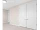 Bedroom featuring neutral walls, carpet, overhead light and closet with double doors at 1074 Wylie Falls Ln, York, SC 29745