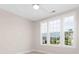 Bedroom with large windows offering neighborhood views and abundant natural light at 1074 Wylie Falls Ln, York, SC 29745
