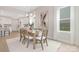 Formal dining room next to kitchen features modern lighting fixture and neutral decor at 1074 Wylie Falls Ln, York, SC 29745