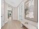 Bright foyer features hardwood floors, white french doors, modern artwork, and a bench at 1074 Wylie Falls Ln, York, SC 29745