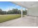 This screened porch offers scenic views of the lush backyard and surrounding landscape at 1074 Wylie Falls Ln, York, SC 29745