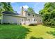 Backyard featuring a back deck, large yard, and the back of the house at 1109 Sunnyview Cir, Matthews, NC 28105