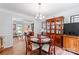 Open dining room with classic wood furnishings that create a seamless transition to living areas at 1109 Sunnyview Cir, Matthews, NC 28105