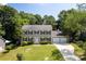Traditional two-story home with a manicured lawn, attached two car garage, and classic shutters at 1109 Sunnyview Cir, Matthews, NC 28105