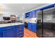 Contemporary kitchen featuring a large refrigerator, island with drawers, and hardwood floors at 1109 Sunnyview Cir, Matthews, NC 28105