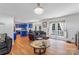 Bright living room showcasing an open layout connecting to the kitchen and featuring access to an outdoor area at 1109 Sunnyview Cir, Matthews, NC 28105