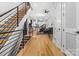 Bright, open-concept living room with hardwood floors, stairs, and modern decor at 1113 Greenleaf Ave # A, Charlotte, NC 28202