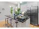 Contemporary kitchen featuring stainless steel appliances, granite counters, and bar stool seating at 1113 Greenleaf Ave # B, Charlotte, NC 28202