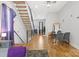 Open-concept room showcasing hardwood floors, modern staircase, and dining area at 1113 Greenleaf Ave # B, Charlotte, NC 28202