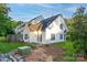 Two-story home featuring well-maintained lawn, mature trees, and exterior in a wooded backyard setting at 11531 Delores Ferguson Ln, Charlotte, NC 28277