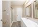 Bathroom featuring a framed mirror, vanity and shower with sliding glass door at 11531 Delores Ferguson Ln, Charlotte, NC 28277