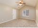 Bright carpeted bedroom with a vaulted ceiling, fan and large window at 11531 Delores Ferguson Ln, Charlotte, NC 28277