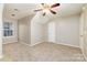 Bright carpeted bedroom with a ceiling fan and a large window at 11531 Delores Ferguson Ln, Charlotte, NC 28277