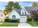 Charming home showcasing mature landscaping, a gray roof and a one car garage at 11531 Delores Ferguson Ln, Charlotte, NC 28277