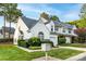Exterior view of home displaying manicured lawn and white siding at 11531 Delores Ferguson Ln, Charlotte, NC 28277