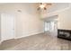 Open concept living room with vaulted ceiling and view into hallway and kitchen at 11531 Delores Ferguson Ln, Charlotte, NC 28277
