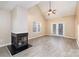 Inviting living room with fireplace, vaulted ceiling and access to the backyard at 11531 Delores Ferguson Ln, Charlotte, NC 28277