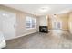 Spacious living room with fireplace and double doors at 11531 Delores Ferguson Ln, Charlotte, NC 28277