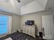 Bedroom with a white dresser, TV, and a pet bed next to the window at 1344 Moonshadow Ln, Shelby, NC 28150