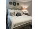 Beautiful bedroom with a cozy bed, decorative pillows, and wreaths at 1344 Moonshadow Ln, Shelby, NC 28150