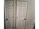 Image featuring two white doors with bronze handles in a hallway setting at 1344 Moonshadow Ln, Shelby, NC 28150