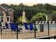 Inviting community pool area with lounge chairs, umbrellas, and a secure fence for safety at 1344 Moonshadow Ln, Shelby, NC 28150