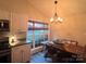 Dining area with vaulted ceilings and wooden table at 1344 Moonshadow Ln, Shelby, NC 28150
