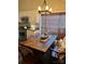 Charming dining area featuring a rustic wooden table and modern light fixture at 1344 Moonshadow Ln, Shelby, NC 28150