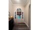 Entryway showcasing elegant door with sidelights, transom window, and decorative accents at 1344 Moonshadow Ln, Shelby, NC 28150