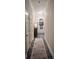 Hallway with hardwood floors leading to the front door and features neutral wall color at 1344 Moonshadow Ln, Shelby, NC 28150