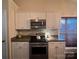 Stylish kitchen featuring stainless steel appliances and white cabinetry at 1344 Moonshadow Ln, Shelby, NC 28150