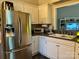 Open kitchen with a stainless steel refrigerator and undermount sink at 1344 Moonshadow Ln, Shelby, NC 28150