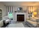 Living room with a fireplace, windows and seating at 1344 Moonshadow Ln, Shelby, NC 28150