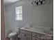 Bathroom featuring double sink vanity and shower/tub combination at 153 Brook Creek Dr, Troutman, NC 28166