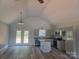 Bright, open kitchen featuring stainless steel appliances and an island at 153 Brook Creek Dr, Troutman, NC 28166