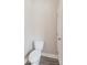A simple toilet in the bathroom features a door to exit the space at 1818 Stowe Ave, Gastonia, NC 28054