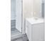 Bathroom with white vanity cabinet and ample counter space with a simple rectangular mirror at 1818 Stowe Ave, Gastonia, NC 28054