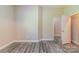 Bedroom with light beige walls and wood-look flooring at 1818 Stowe Ave, Gastonia, NC 28054