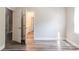 Bedroom features neutral paint, wood look floors, and many open doorways at 1818 Stowe Ave, Gastonia, NC 28054