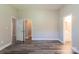 Spacious bedroom with neutral walls and hardwood floors at 1818 Stowe Ave, Gastonia, NC 28054